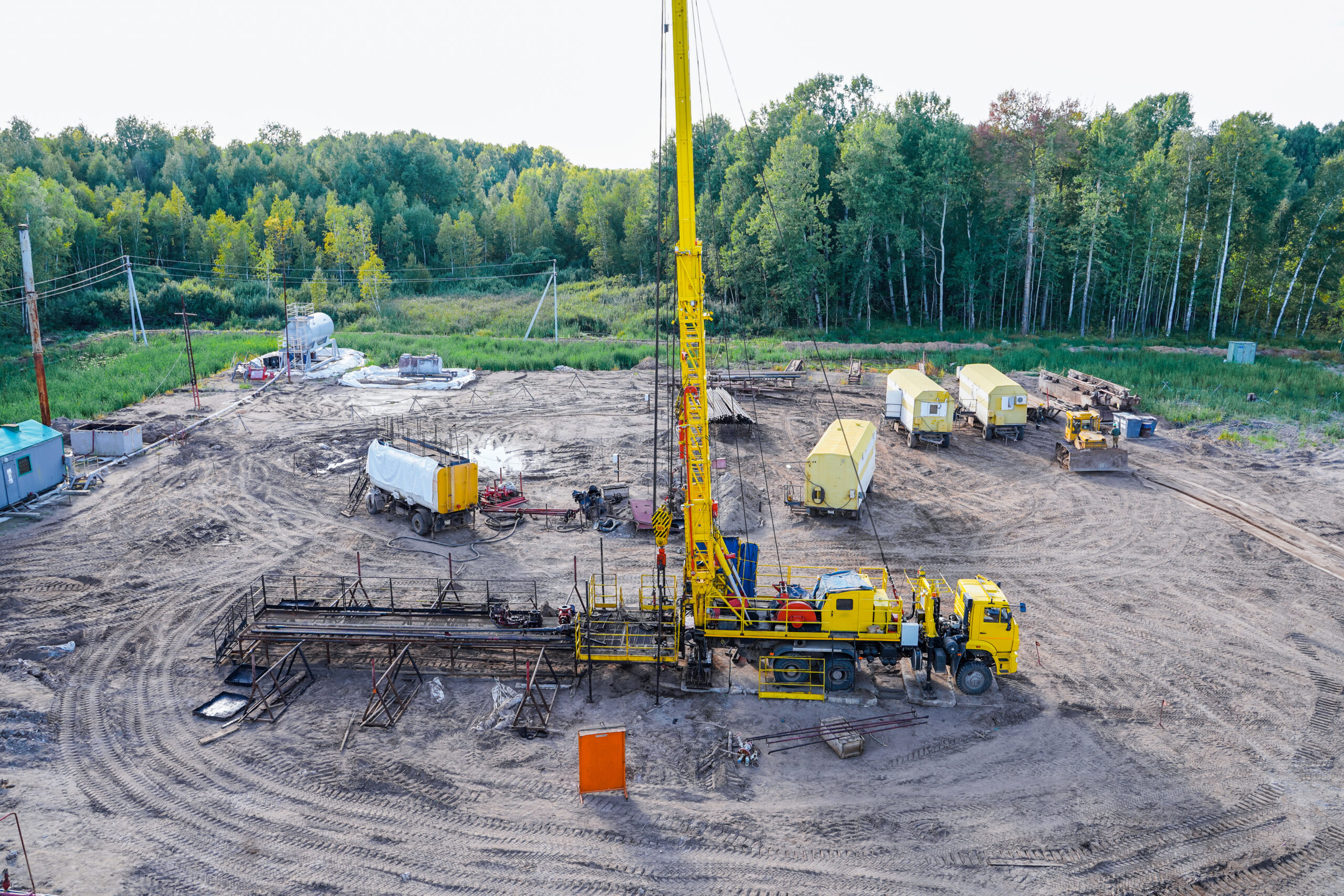 special equipment for drilling an oil well in an oil field. workover rig working on a previously drilled well trying to restore production through repairin a row are oil producing wells.